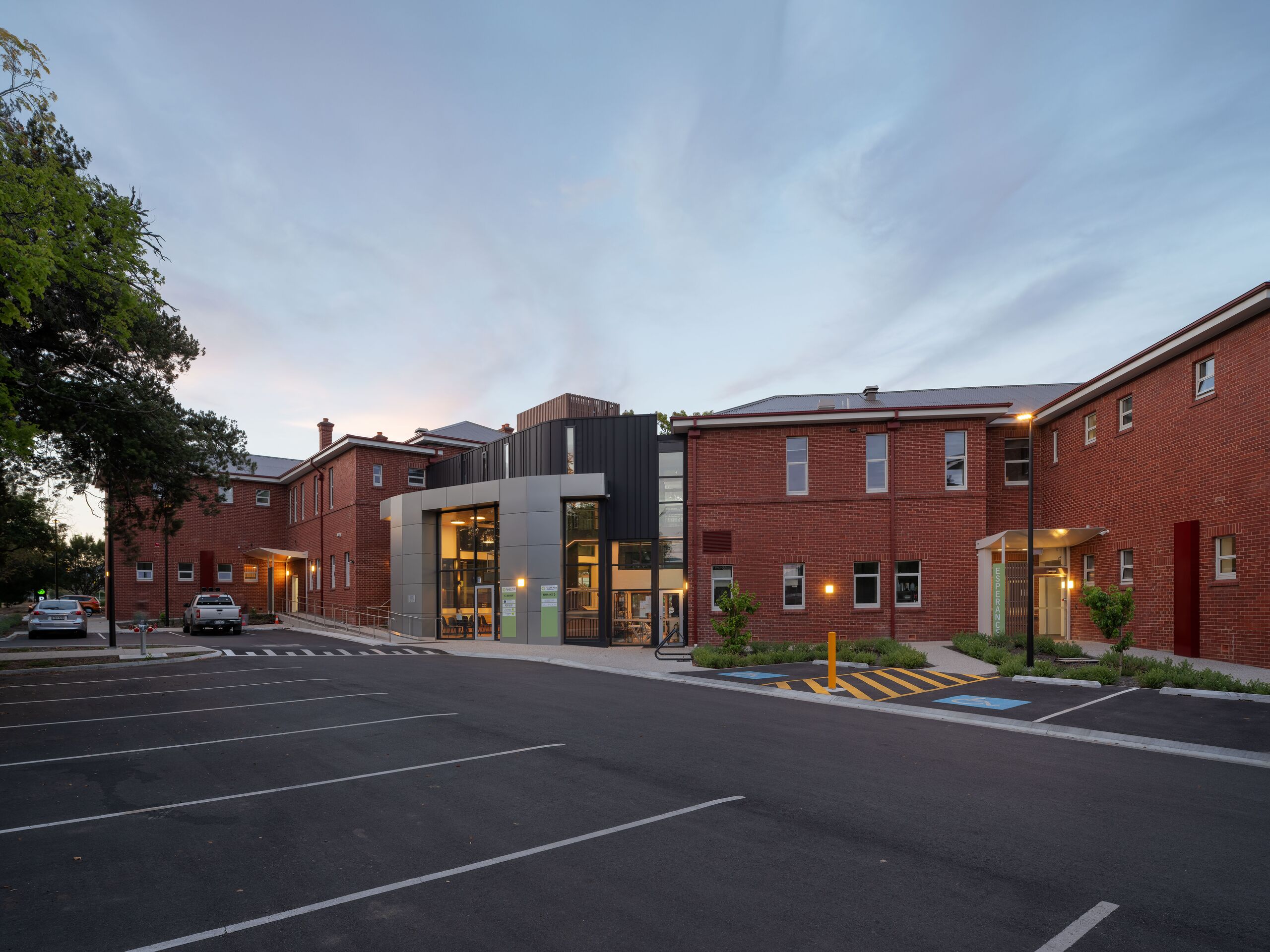 Forecourt and car park in front of Derwent House and Esperance House at dusk