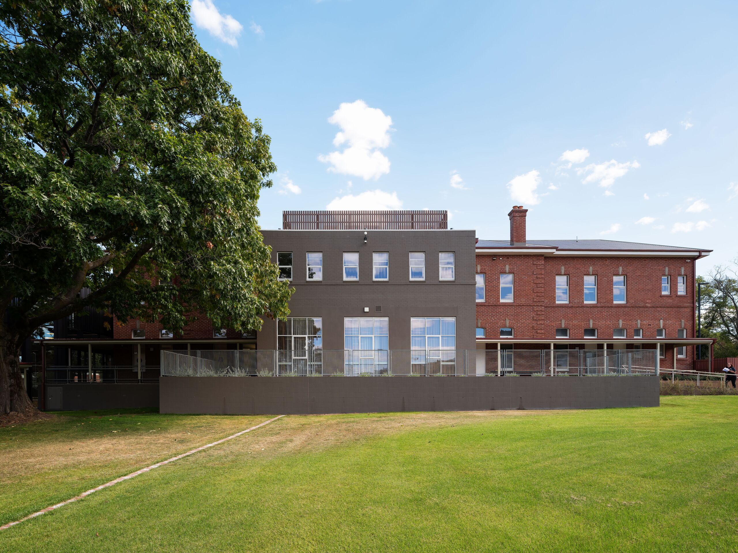 Garden elevation of the heritage buildings across the rear lawn